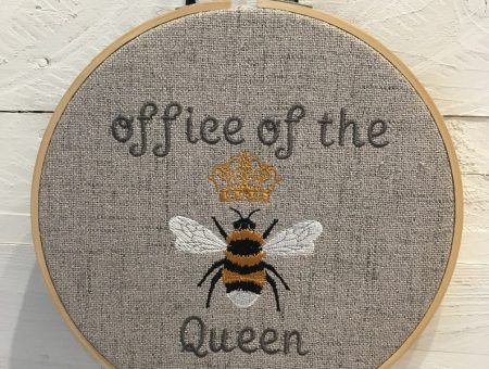 cute grey embroidery loop with a detailed bumblebee design and wording, reading 'office of the queen bee'.