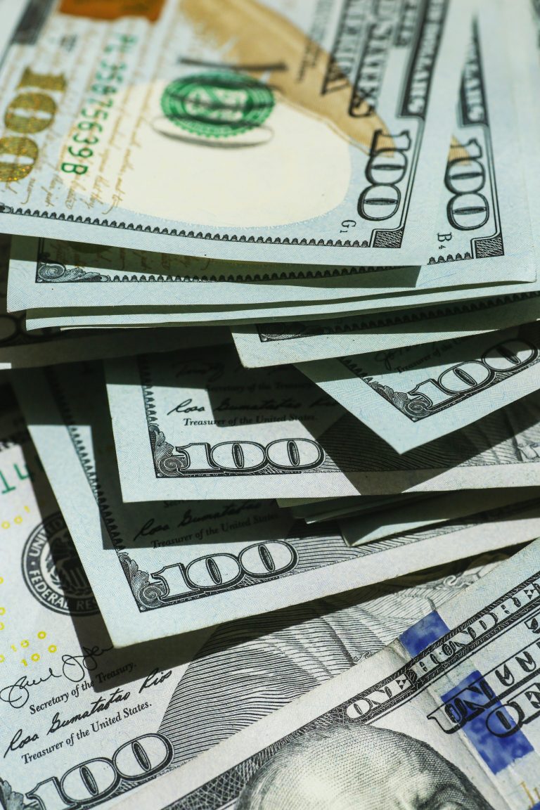 a close up image showing a collection of American (US) Dollars.